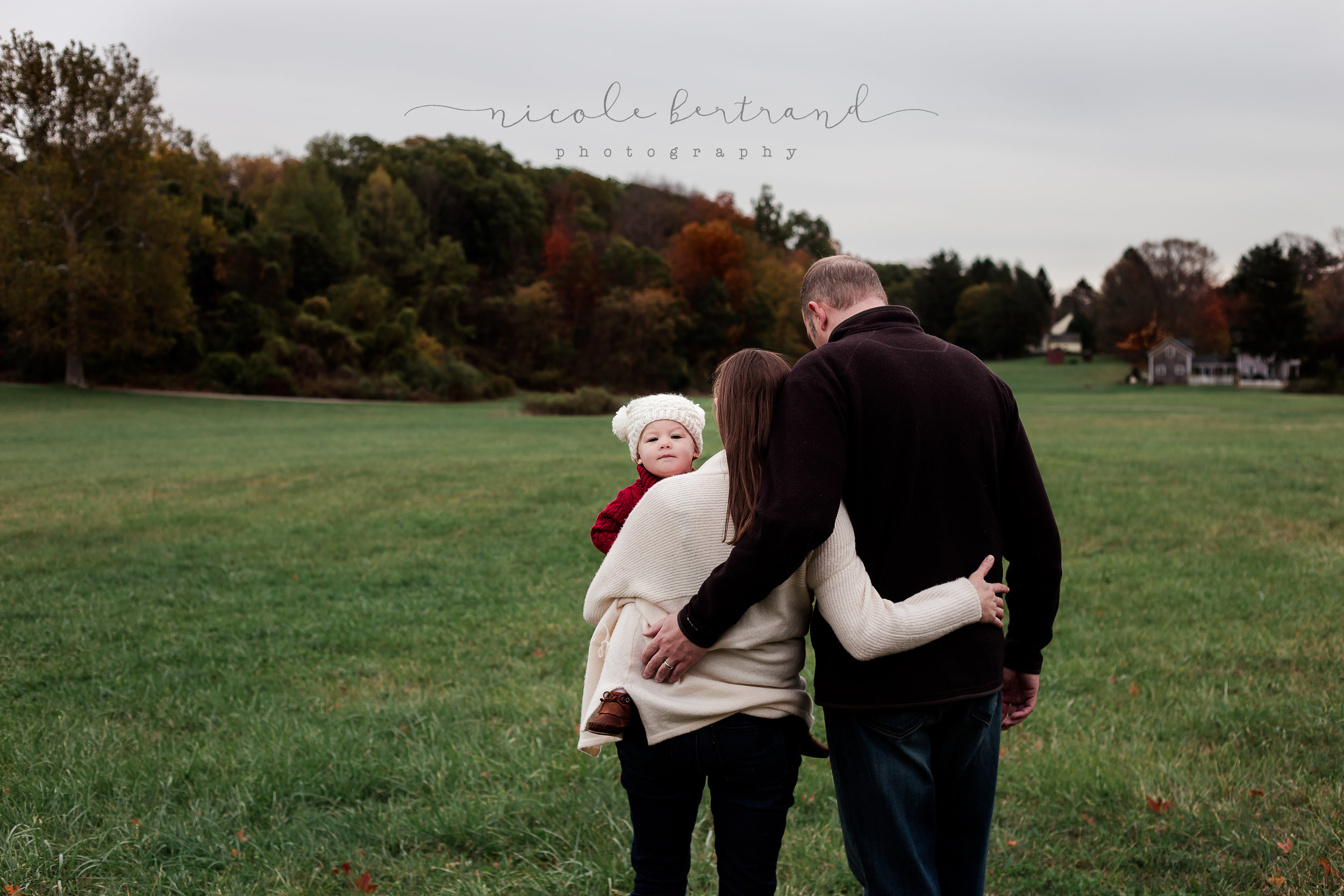family hugging baby during lifestyle newborn session