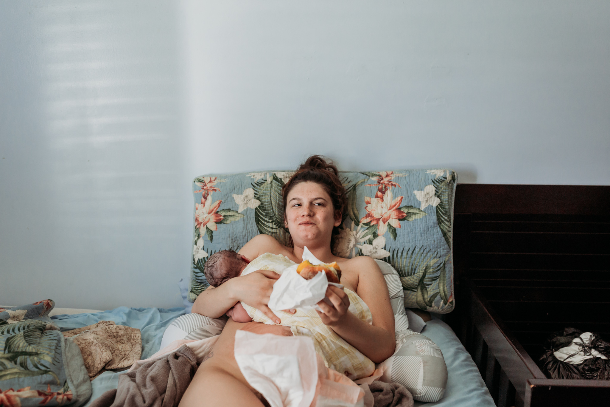mom eats in bed with baby postpartum home birth
