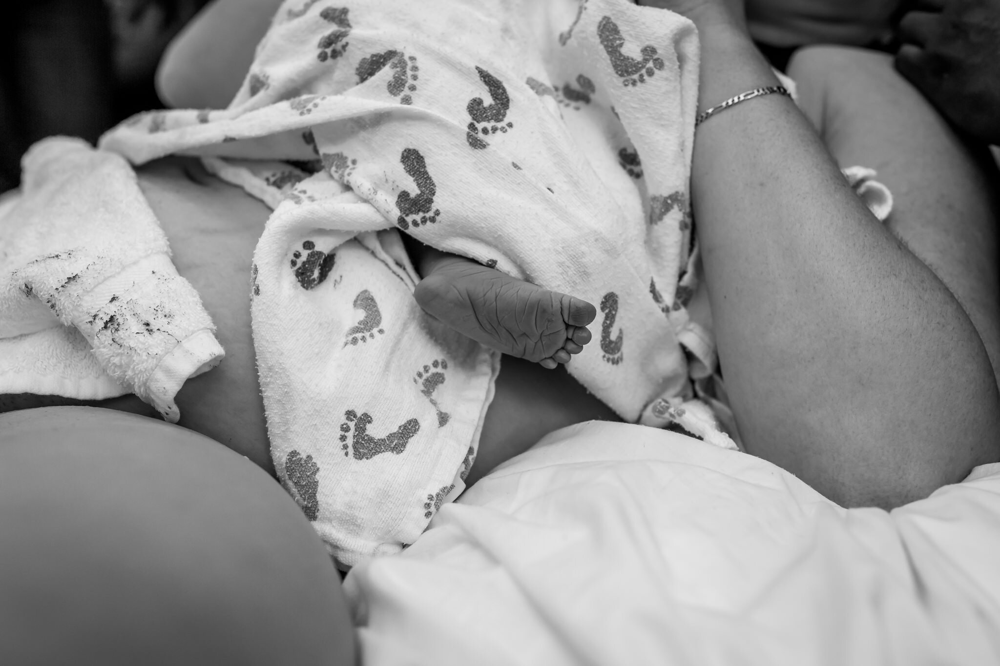 close up of newborn foot birth center birth