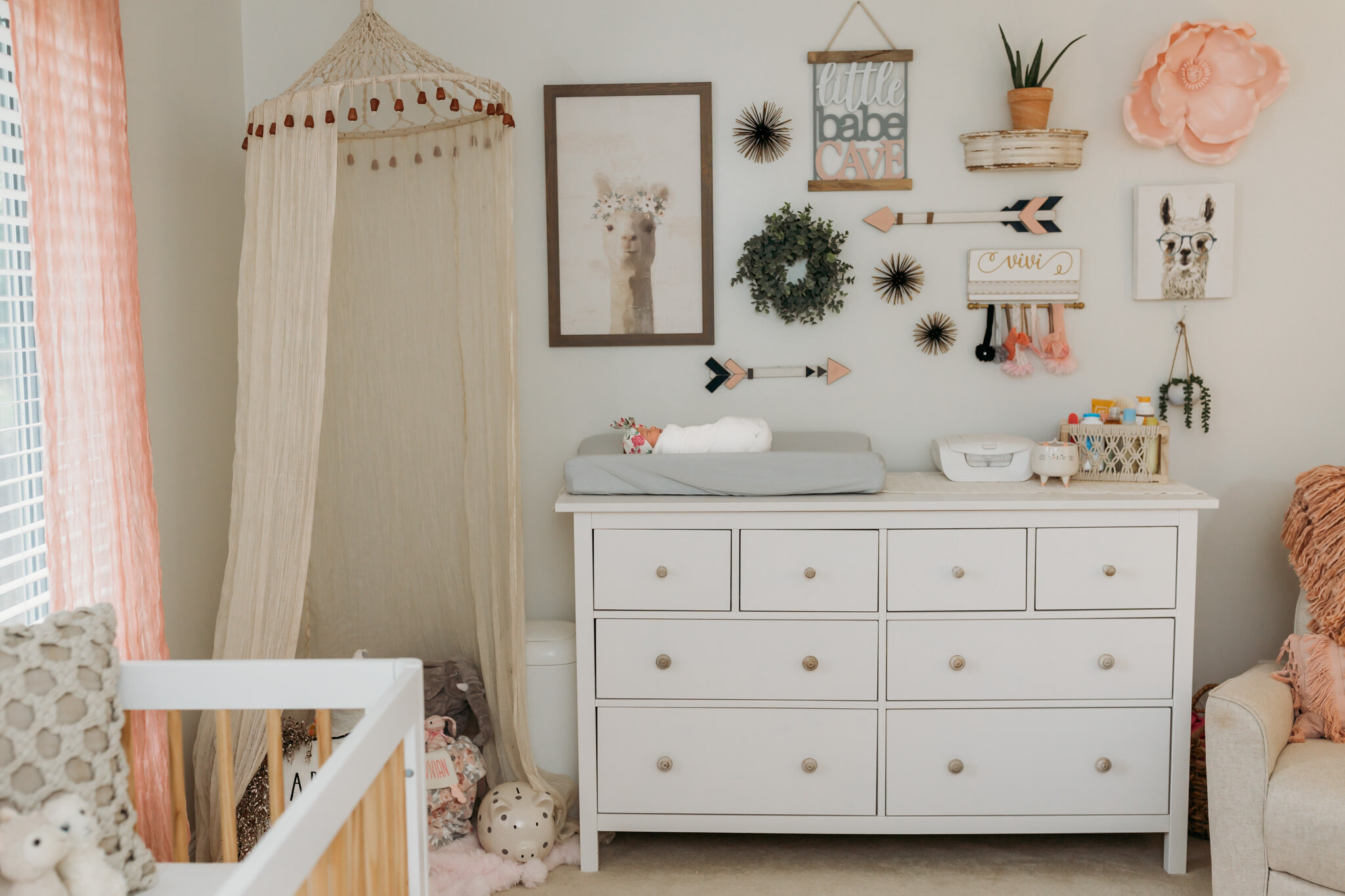 baby girl on changing table in chic nursery