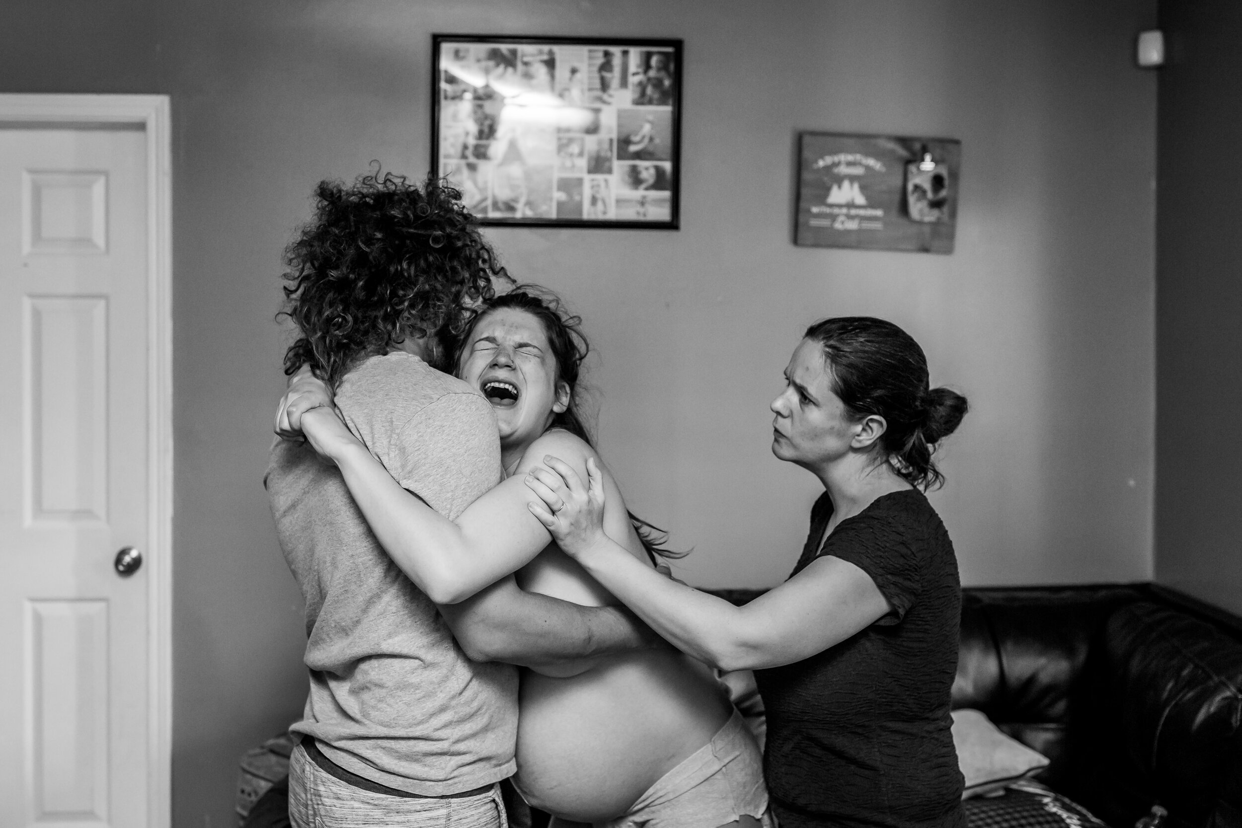 laboring mom husband comforting doula through contraction