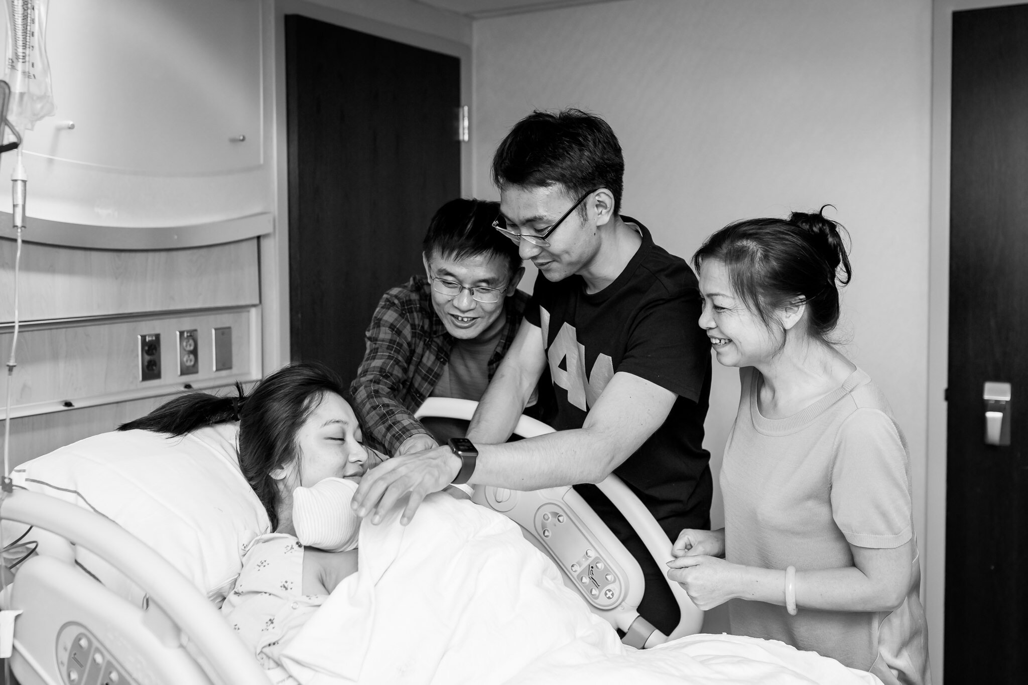 family meet newborn baby after hospital birth