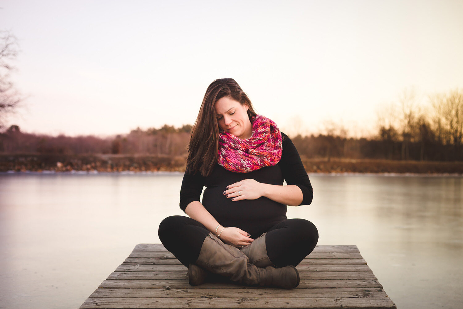 pregnancy photos on pier next to lake