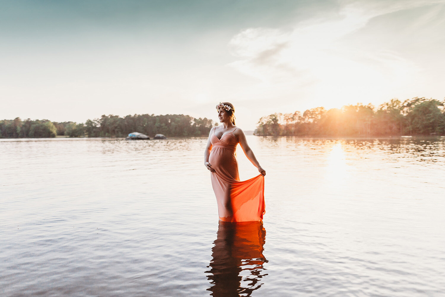 pregnant woman in water orange dress