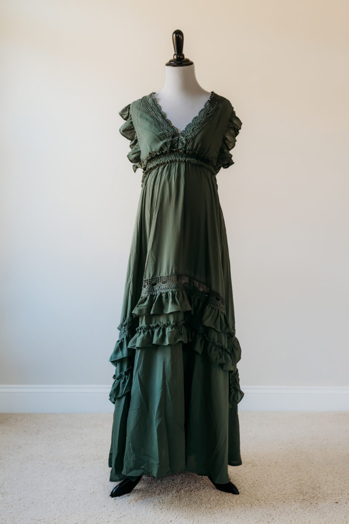 Army green V-neck maternity photography dress with crochet lace trim and cute ruffle accents