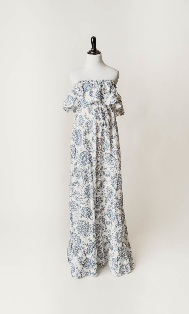 strapless empire waist maternity maxi dress with blue floral design on a white background