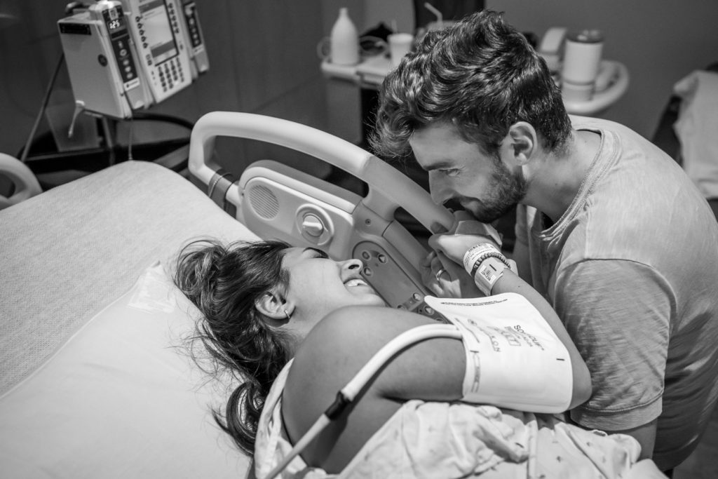 Couple laughing during hospital birth labor