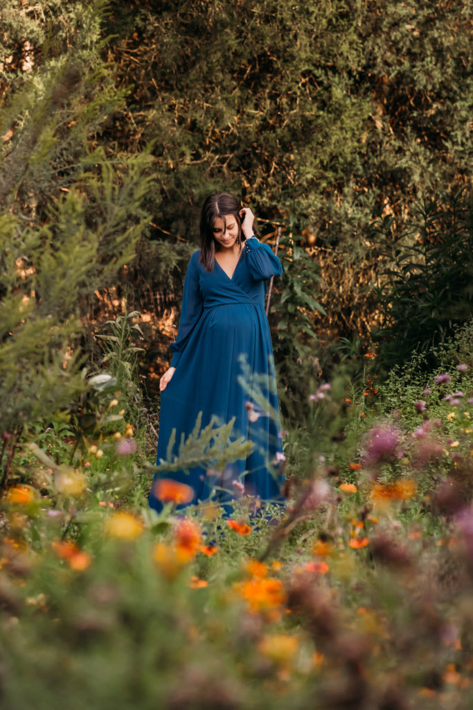 pregnant woman in field of flowers