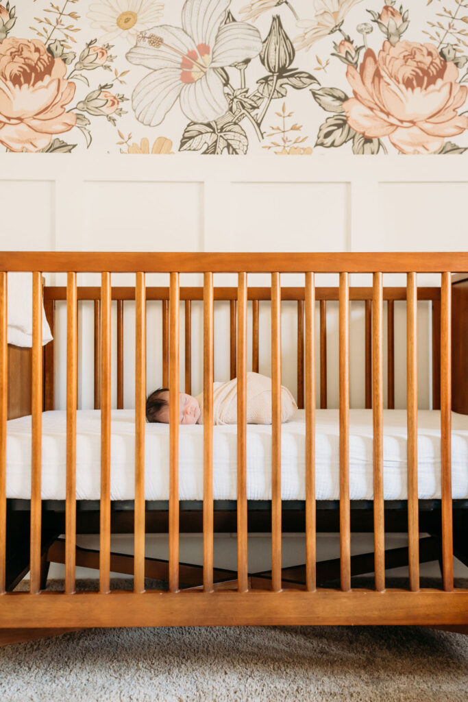 Baby in crib during lifestyle newborn session