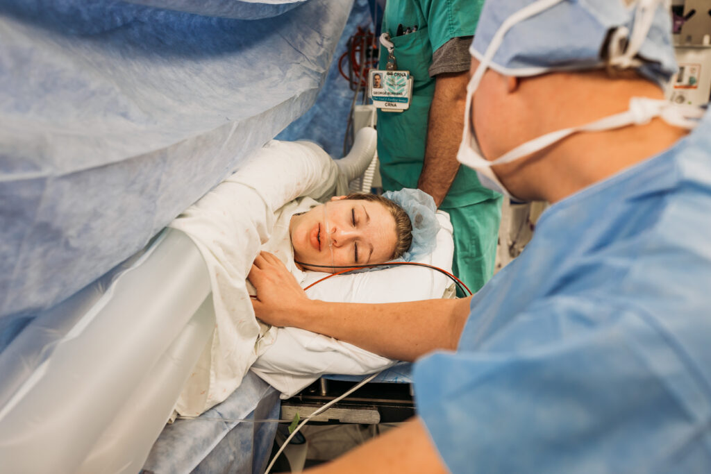 Mom taking a deep breath during c-section