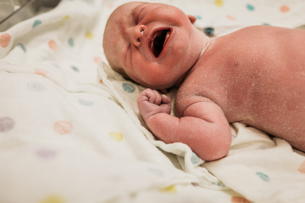 close up of baby crying after c-section