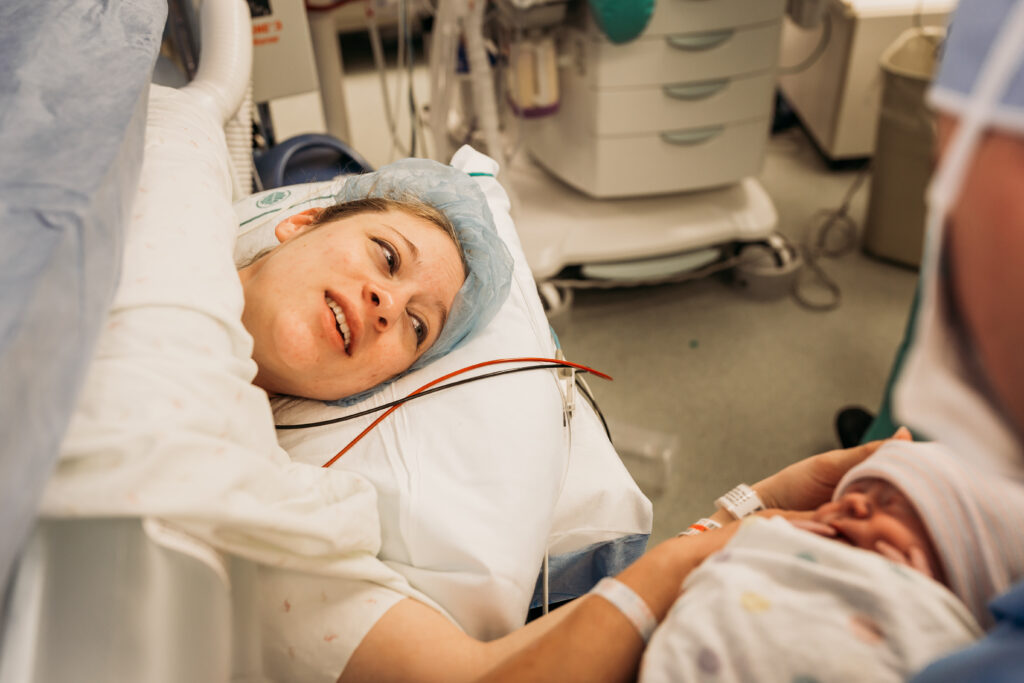 Mom looking at baby during c-section birth