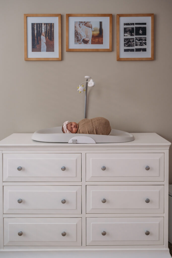 newborn baby on changing table