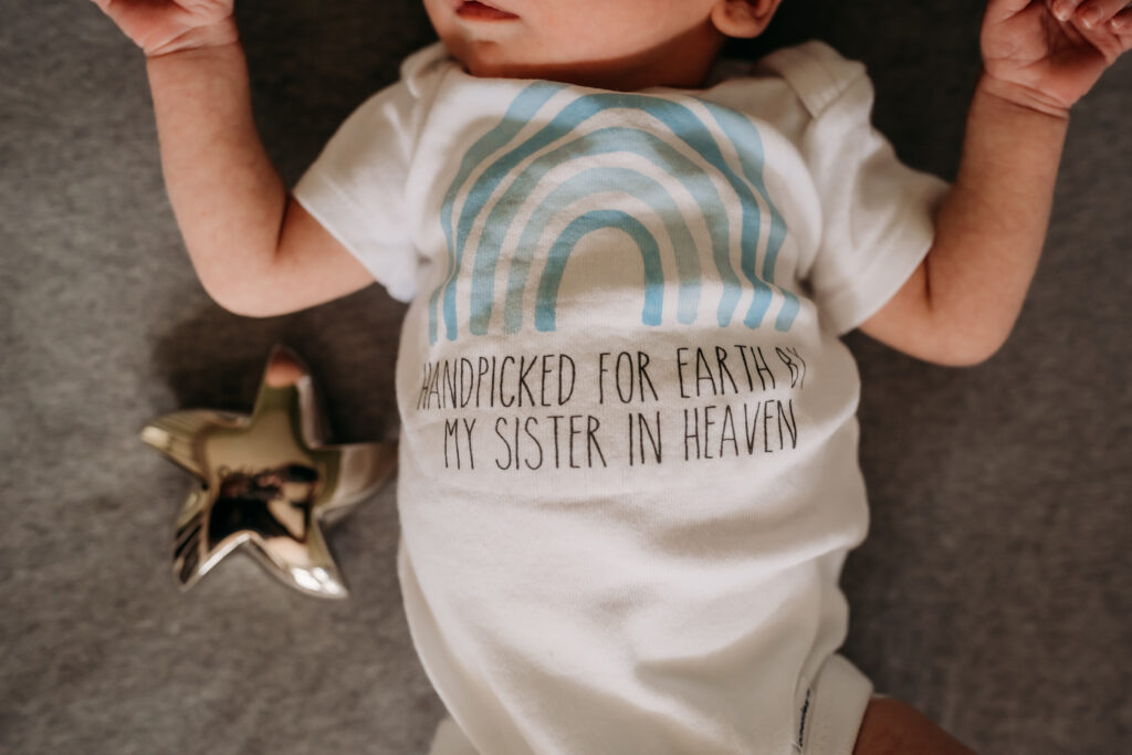 baby wearing onesie from baby registry
