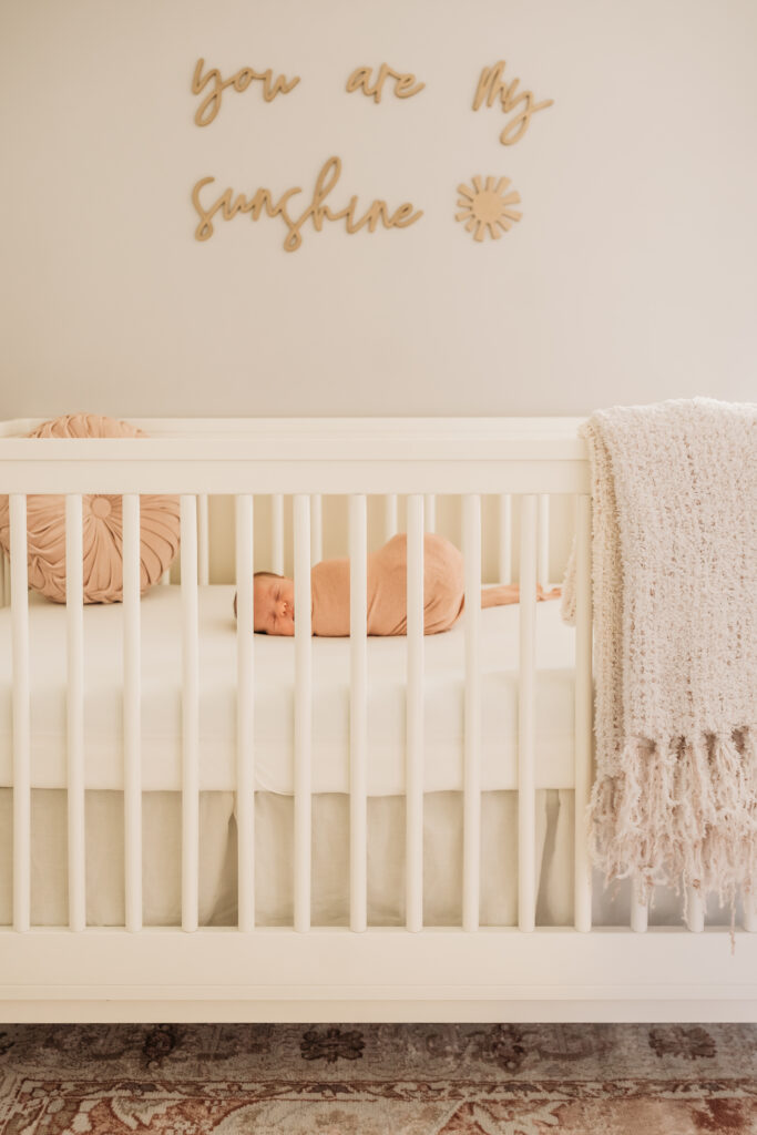 baby laying in her crib