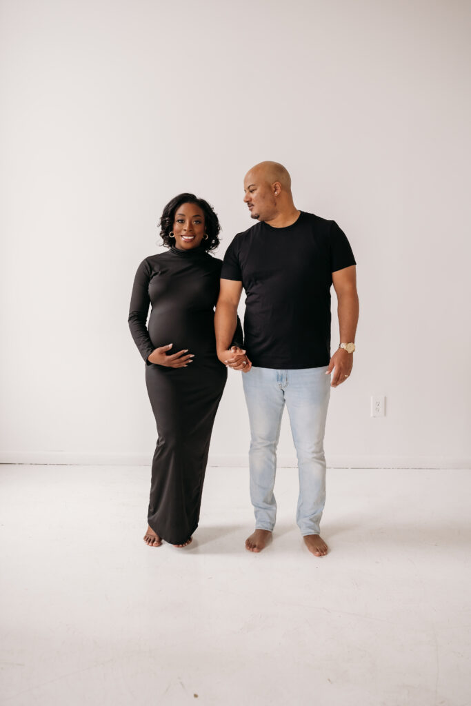 maternity couple in all black for maternity pregnancy cravings photoshoot