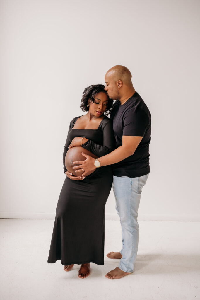 dad caressing mom for maternity pregnancy cravings photoshoot