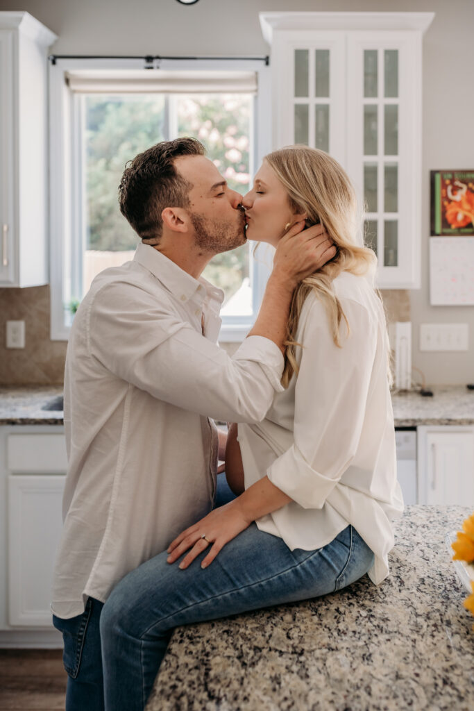 Mom and dad kissing in the kitchen